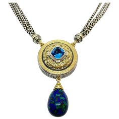 Presenting S.Georgios all handmade Pendant Necklace which is crafted from Sterling Silver and solid 18 Karat Yellow Gold granulations inlay to create a unique elaborate Byzantine look. This stunning Necklace features a 4.55 Carat Square Cushion cut sky blue Topaz and a beautiful pear-shaped hanging Lapis Lazuli. This unique necklace has a sterling silver triple strand chain full length 24 inches. This unique pendant Necklace can be made with White or Rose Gold decorations and with other semi-pre Rose Gold Decorations, Diamond And Pearl Necklace, Gold Decorations, Lapis Pendant, Handmade Pendant Necklace, Unique Pendant Necklace, Pearl And Diamond Necklace, Sky Blue Topaz, Antique Necklace