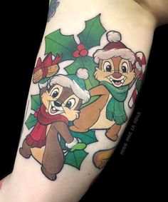 a person with a christmas themed tattoo on their arm