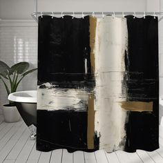 a black and white shower curtain with gold stripes