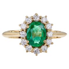 Classic Cluster Ring 18kt Yellow Gold with Oval Emerald 1.34 Carat and Diamonds A rare emerald give a stylish sense to your appearance. Classic beauty in this ring. IN STOCK AT SIZE Stone details: Emerald, oval mix cut, 1.34 Catat, diamonds brillant cut, 0.51 Carat. Collection: Metalloplasies Information: Limited Edition THE DESIGNER Talented and knowledgeable, Nicofilimon (aka Nikos Garbis) uses his creativity to embrace jewelry design as the noble form of craftsmanship that it is. His studies in jewelry design, gemology and the art of diamonds harmoniously blend with his training in classical music, jazz and composition, turning his artistic inspiration into a profound vision of beauty. Each and every one of his creations reflects a fragment of his influences while, at the same time, it Classic Yellow Gold Emerald Ring With Halo, Classic Green Diamond Halo Ring, Oval Yellow Gold Emerald Ring With Halo, Luxury Green Oval Cluster Ring, Classic Green Cluster Ring With Halo, Oval Emerald Ring In Yellow Gold With Halo Setting, Classic Green Emerald Ring With Halo, Gia Certified Oval Emerald Ring In Yellow Gold, Gia Certified Oval Emerald Cluster Ring