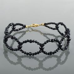 "Gemstone : Black Spinel  Handmade bracelet Gemstone Color : Black Gemstone Size : 2.5MM Approx. Gemstone Shape : Round Gemstone Finish : Faceted Stone Beads : 18CM Silver Lock : 8MM Total Length Of bracelet 20CM Can be Personalized : Yes Carat Weight : Approx. 30 carat Materials : 925 Sterling Silver Plating : Yellow Gold Plating, Rose Gold ,Silver Plating All of my jewelry is designed and handcrafted by me. I love to experiment with many different designs and although I may make similar designs more than once, each piece of jewelry is truly one of a kind due to variations between gemstones and within my own craft work. All my jewelry is carefully packed So it ready for gift giving, whether it is a gift for you or someone special. Treatment : 100% Natural Free Customization Available / IF Black Crystal Jewelry With Faceted Beads, Elegant Black Bracelets With Faceted Beads, Black Faceted Beads Crystal Bracelet For Party, Black Crystal Bracelet With Faceted Beads For Party, Elegant Black Crystal Bracelet With Faceted Beads, Elegant Onyx Bracelets With Faceted Beads, Elegant Onyx Bracelet With Faceted Beads, Adjustable Black Crystal Bracelet, Elegant Black Beaded Crystal Bracelet