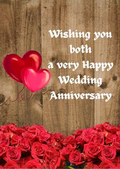 red roses and two heart balloons are in front of a wooden background with the words wishing you both a very happy wedding anniversary