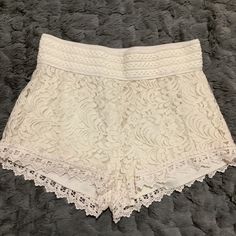 Nwot A Pair Of Jr's Cream Crochet, Lace Overlay Shorts By Ambiance Apparel. Size: Large * Elastic Wide Waistband * Self: Cotton/Nylon * Solid Soft Lining: 100% Polyester Approx Measurements Laying Flat * Length Front 12" Back 12.5" * Waist 14’ Summer Lace Bottoms With Lace Patchwork, Summer Lace Shorts With Lace Trim, Casual Summer Bottoms With Lace Patchwork, Casual Lace Bottoms With Lace Patchwork, Casual Lace Bottoms With Patchwork, Casual Lace Patchwork Bottoms For Summer, Casual Lace Patchwork Bottoms, Summer White Bottoms With Lace Patchwork, White Bottoms With Lace Patchwork For Summer