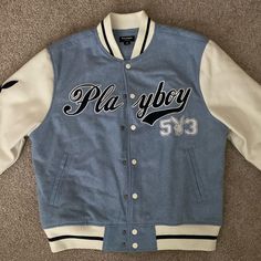 Size Small Playboy Jacket By Pacsun Blue And White Exterior Dark Blue Lettering And Sleeve Insignia Brand New No Tags Never Worn White Snap Buttons Light Blue Interior Trendy Blue Varsity Jacket With Letter Print, Trendy Blue Varsity Jacket For Streetwear, Winter Blue Outerwear With Letter Print, Trendy Blue College Varsity Jacket, Blue Varsity Jacket With Baseball Collar, Blue Urban Varsity Jacket With Baseball Collar, Blue Varsity Jacket For Spring Streetwear, Blue Letter Print Outerwear For College, Blue Outerwear With Letter Print For Spring