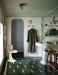 a bathroom with tiled flooring and white walls