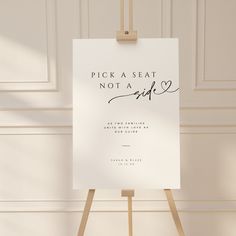 a sign that says pick a seat not a side on top of a easel