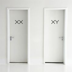 two white doors with faces drawn on them and the words problem solver written in black