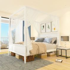 a white bed sitting in a bedroom on top of a hard wood floor next to a window