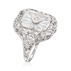 Ross-Simons - C. 1950 Vintage 2.00ct Rock Crystal Filigree Ring, Diamond Accent in 10kt White Gold. Size 7. C. 1950. Boasting a fabulous frosty look, this Estate collection ring is a true Retro-era treasure with its fine filigree work. A 2.00 carat rectangular rock crystal centerpiece is elegantly etched and centered by a sparkling diamond accent. Set in polished 10kt white gold with intricate openwork throughout the sizable 2" wide design. Rock crystal filigree ring. Exclusive, one-of-a-kind Es Classic Filigree Ring With 17 Jewels For Wedding, Oval Filigree Ring With 17 Jewels For Anniversary, Vintage White Gold Filigree Ring, Vintage Platinum Rings Hallmarked, Classic White Cluster Ring Hallmarked, Vintage Hallmarked Platinum Rings, Vintage White Gold Jewelry With Diamond Accents, Antique White Filigree Ring With Diamond Cut, Vintage 14k White Gold White Diamond Ring