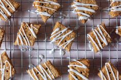 several cookies with icing on a cooling rack