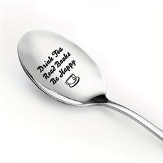 a spoon with writing on it that says drink tea, never forgets be happy