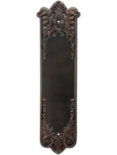 an ornate metal door handle on a white background