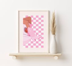 a white vase sitting on top of a shelf next to a pink and white checkered wall