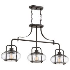 From the Quoizel brand of lighting, the Trilogy chandelier provides a bright style lift for your decor. Ideal for use over kitchen islands or bar seating areas, the design has an open and linear frame in a classic bronze finish. Three seeded glass elements shine out and down on counter and table surfacesd. The clear glass allows the bulbs to be seen, and decorative Edison filament bulbs are recommended for use. Island Chandelier, Kitchen Island Linear Pendant, Vintage Bulbs, Quoizel Lighting, Bronze Chandelier, Led Stripes, Kitchen Island Pendants, Filament Bulb, Linear Chandelier