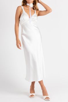 Giving us angel energy with a bit of spice. The Ethereal Slip Dress is the dress of the season! Made from satin with lace trim, open back detail and a midi length. Color: White Satin Midi Length Lace Trim Open Back With Button Closure Polyester Lined Model Is 5'5", 24/25 Waist, 32A Bust & Wearing Size Small Evening Satin Midi Dress With Lace Trim, Satin Midi Dress With Lace Trim For Evening, Satin Midi Dress With Lace Trim, White Satin Finish Dress With Spaghetti Straps, Satin Midi Length Dresses With Lace Trim, Summer Satin Midi Dress With Lace Trim, Spring Satin Dress With Lace Trim, Spring Satin Dress For Wedding Night, Spring Satin Wedding Night Dress