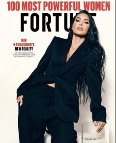 a magazine cover with a woman in a suit and heels on the cover, sitting down