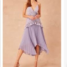 Periwinkle Mindful Midi Dress. V Neck Line With Spaghetti Straps. Spring Pleated Midi Dress For Dinner, Spring Ruffled Dresses For Dinner, Spring Dinner Dresses With Ruffles, Spring Dinner Dress With Ruffles, Lavender Midi Dress For Summer Date Night, Lavender Midi Dress For Date Night In Summer, Summer Lavender Midi Dress For Date Night, Spring Midi Dress With Ruffles For Dinner, Sleeveless Lavender Midi Dress For Party