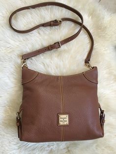 Dooney And Bourke Frederica Crossbody Purse. Gently worn once still like new condition. Exterior and interior clean. Pebbled Leather/ good tone hardware. 10.5”W x 8.5”H x 2.5”D. Adjustable shoulder strap is 47.5”in length on last hole and can be made shorter. Interior Clean, Dooney And Bourke, How To Make Shorts, Dooney & Bourke, Crossbody Purse, Dooney Bourke, Pebbled Leather, Purses Crossbody, Bags Handbags