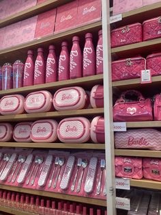 the shelves are filled with pink items for sale