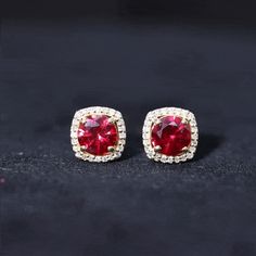 Product Details Enhance your everyday ensembles with a touch of red elegance through these exquisite certified lab-created ruby stud earrings. These captivating earrings feature a splendidly Created ruby delicately nestled within a glistening halo of Diamond, creating a mesmerizing play of red and white hues. This stunning accessory serves as the perfect go-to piece for every woman, elevating her style with its timeless beauty and sophistication. Product Information SKU SHP-EARRINGS052174748 Wei Ruby Earring, Ruby Stud Earrings, Ruby Earrings Studs, Halo Stud Earrings, Halo Earrings Studs, Ruby Earrings, Halo Diamond, Every Woman, Her Style