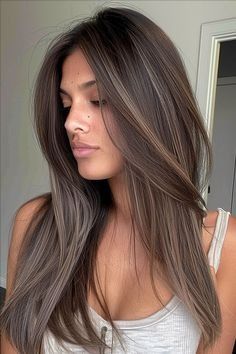 Elegant Long Layered Haircuts to Enhance Straight Hair Long Layers Brunette Hair Straight, Natural Hair Color Ideas For Straight Hair, Partial Highlights For Dark Hair Straight, Beige Brown Highlights On Dark Hair, Sleek Brunette Hair, Dark Ash Brown Dimensional Hair, Fall Hair Low Maintenance, Highlights Dark Hair Straight, Balyage Long Hair Brunettes Straight Hair