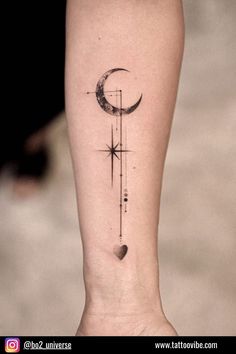 a tattoo on the leg of a woman with a crescent and stars in the sky