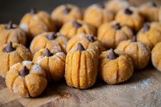 several pumpkin shaped cookies with chocolate chips on top