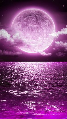 a purple moon over the ocean with clouds