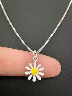 "Dainty Daisy Necklace, Sterling Silver Daisy Pendant, NECKLACE FEATURES: Metal:  All components are made from solid .925 Sterling Silver  Model is wearing 16\" in length  solid .925 Sterling Silver Chain Length available:  16\", 18\" or 20\" Measurements: 18K Yellow Gold Plated over solid .925 Sterling Silver Daisy Pendant Height: 10MM Width:  10MM Petals:  Solid .925 Sterling Silver Center Flower:  18K Yellow Gold Plated over solid .925 Sterling Silver  Please send me a message if you have any Yellow Flower Necklaces For Jewelry Making, Yellow Flower Shaped Necklace For Gift, Yellow Flower Shaped Necklaces For Gifts, Yellow Flower Pendant Necklace For Weddings, Yellow Daisy Shaped Jewelry Gift, Dainty Yellow Flower Necklace, Cute Daisy Shaped Jewelry With Flower Charm, Delicate Yellow Flower Necklace, Yellow Flower-shaped Necklace For Gift