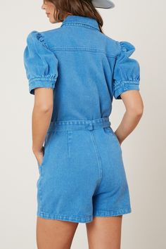 washed twill denim puff sleeve romper in washed blue style #: IR34941-03 - 3/4 button down closure - Front pockets with flap - Waist tie - Collared - Short puff sleeves Blue Cotton Bubble Romper With Short Sleeves, Denim Blue Button-up Jumpsuits And Rompers With Relaxed Fit, Light Wash Denim Button-up Jumpsuits And Rompers, Fitted Short-length Blue Denim Jumpsuit, Short-sleeve Denim Jumpsuit With Pockets, Peach Love, Sleeved Romper, Waist Tie, Blue Fashion