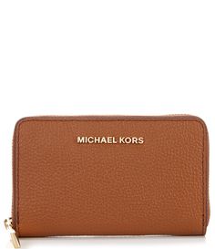 From Michael Kors&#x2C; the Jet Set Small Zip Around Pebble Leather Card Case Wallet features:Mercer pebble leatherRhodium gold-tone hardwareZip closureInterior center card pocket&#x2C; 2 back card pockets&#x2C; 2 front card pocketsExterior back slip pocketApprox. 5" W x 3.25" H x 0.75" DImported. Classic Michael Kors Wallets For Travel, Michael Kors Classic Wallets For Travel, Michael Kors Brown Wallet For Everyday, Classic Michael Kors Travel Wallet, Luxury Michael Kors Travel Wallets, Michael Kors Classic Travel Wallet, Classic Michael Kors Leather Wallet, Michael Kors Travel Wallet, Michael Kors Brown Wallet With Interior Card Slots