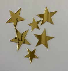 five gold stars with the word love written on them