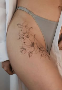 a woman's stomach with flowers on it