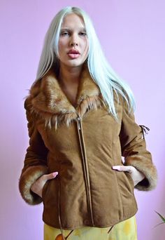 Brown faux shearling coat with faux fur. Fastened with a zipper. It has 2 pockets on the front. The sleeves and collar are finished with faux fur. The jacket is very warm Brand: FEIFA Size - S MEASURMENTS:  length - 61 cm sleeves - 63 cm chest - 49 cm x 2 waist: 47 cm x 2 Material: no label Condition: Very Good  All items are vintage and may show some signs of wear. We carefully select items in the best condition and we will inform you if there was any flaws. The model in this pic is 170 cm and usually wears size XS/S clothes. Sending out next 2 business days. Be sure to contact us with any questions. Cukier Puder Vintage Store Vintage Faux Fur Outerwear With Long Sleeves, Vintage Faux Fur Long Sleeve Outerwear, Vintage Long Sleeve Faux Fur Outerwear, Retro Long Sleeve Fur Coat For Winter, Retro Long Sleeve Winter Fur Coat, Retro Outerwear With Faux Fur Lining, Winter Hooded Fur Coat With Zipper Closure, Hooded Fur Coat With Zipper For Winter, Retro Winter Outerwear With Faux Fur Trim