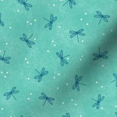 a green background with blue and white dragonflies on the side, all over it