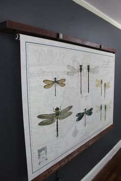 a wall hanging with dragonflies on it