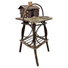 an old fashioned bar stool with a house on it