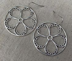 "These are so unique and cool! Big silver flower hoop earrings. They are modern and whimsical. Eye catching and versatile. Dress them up or down. The earrings measure 1 3/8\" long by 1 3/8\" wide and are made from plated silver. They hang from simple silver ear wire hooks. Overall drop length is 1 1/2\". I have a matching necklace in my shop if you would like the whole set. Here is a direct link Thanks for stopping by! Please take a moment and visit the rest of my Etsy store. I have many more un Hoop Earrings Big, Modern Hoop Earrings, Flower Hoop Earrings, Hoop Earrings Large, Silver Flower Necklace, Geometric Hoop Earrings, Earrings Big, Floral Hoops, Real Jewelry