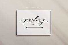 a white framed sign with the words,'thinking this way'in cursive writing