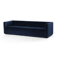 a dark blue velvet sofa on a white background