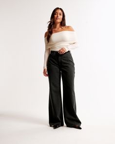 Our Curve Love high rise wide leg jeans in a saturated black wash with a clean hem. This fit features a 10.5” high rise, is relaxed at the waist and hips, and eases into a wide, full-length leg shape. The viral fit that eliminates waist gap: Curve Love features additional room through the hip and thigh for curve-hugging comfort. This jean is made from our super light drapey denim fabric, which features a super soft lightweight rigid denim. High Rise Wide Leg Jeans, Suits Coats, Athletic Fits, New Arrival Dress, Swimwear Accessories, Denim Fabric, Wide Leg Jeans, Abercrombie Fitch, Leg Jeans