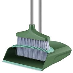 a green dustpan with two brooms attached to it