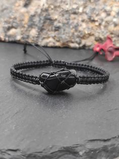 new in shop.  Handmade  adjustable protection bracelet  for everyone, with natural raw black obsidian, knotted with nylon cord.   Bracelet closed length : * 6in (15,4cm)  *  7in(18cm)   * 8in(20cm)     ✧ Please note that no two crystals are alike, therefore shape and size may vary slightly  crystal in length 1,4-1,7cm.  ✧ Each crystal chosen with care and handled with loving intention    ✧ Hand selected natural raw gemstones.  The black obsidian healing properties that are most prominent are its Black Spiritual Friendship Bracelets With Adjustable Cord, Black Hand Wrapped Spiritual Friendship Bracelets, Black Spiritual Friendship Bracelets With Sliding Knot, Adjustable Hand Wrapped Black Jewelry, Spiritual Black Adjustable Friendship Bracelets, Bohemian Black Jewelry With Sliding Knot, Casual Black Hand Wrapped Bracelets, Spiritual Black Friendship Bracelets With Adjustable Cord, Casual Black Hand Wrapped Braided Bracelets