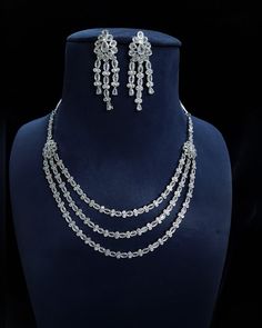 Designer elegant Cubic zirconia necklace set .  This necklace is a perfect example of High Quality handwork . > Premium quality CZ stones  were used in this necklace. Inspired By Sabyasachi Wedding jewelry . Such intricate detailing in this Inspired Heritage Royal Set with american diamond work. This set will surely make heads turn .. Wedding jewelry , wedding necklace , bridal collection , bridal necklace , engagement jewelry , bridal shower jewelry . Sabyasachi Wedding, Sabyasachi Jewelry, Necklace Set With Earrings, Sabyasachi Jewellery, Diamond Jewelry Set, American Diamond Jewellery, American Diamond Necklaces, Zirconia Necklace, Diamond Necklace Set