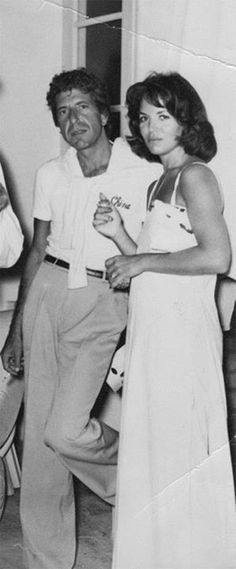 an old black and white photo of two people dancing