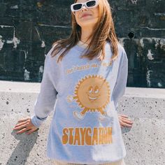 Women's printed sweatshirt with “Staycation” slogan and vintage style sun character graphic. Get set for a Staycation summer in this retro slogan sweater. Super-comfy, oversized fit. This item makes a fun gift for friends and family and it's a must-have for your summer staycation wardrobe.All Batch1 products are lovingly designed, printed and packed by hand in the UK at Batch1 HQ.  Our garments are made to order to minimise wastage and printed using water-based, eco-friendly inks. We are committ Sun Character, Slogan Sweater, Summer Staycation, Sun Graphic, Women Slogan, Slogan Sweatshirt, Wedding Mementos, Character Graphic, Personalize Art