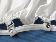 the zippers are attached to the bedding with white fabric on top of it