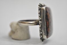 "Mahogany Jasper ring sterling silver natural earth tones women Size 8.75 Weight 10.1g Widest part of band 1 1/8\" Thinnest part of band 1/8\" Free Domestic Shipping and Free Postal Insurance Delivered in a gift Box If you do not want the ring polished and want to leave the natural patina please let me know at the time of purchase as I do polish rings before I ship rings out. Thanks USPS Domestic Shipping is free for buyers. If a buyer prefers to upgrade to priority, the buyer will pay that port Unique Jasper Ring Jewelry, Brown Sterling Silver Cabochon Ring, Brown Sterling Silver Ring With Cabochon, Adjustable Brown Sterling Silver Ring, Artisan Brown Gemstone Rings, Brown Large Stone Ring Jewelry, Brown Large Stone Ring, Collectible Brown Gemstone Rings, Unique Brown Rings For Anniversary