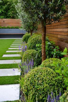 an outdoor garden with grass and trees