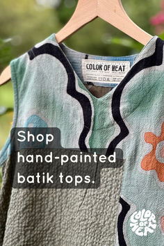 Each of these hand-painted batik tops is completely unique and made of beautifully textured cotton. Front and back are painted in different designs. Hand Printed Relaxed Fit Summer Tops, Hand Printed Relaxed Fit Tops For Summer, Block Print V-neck Tops For Summer, Summer V-neck Tops With Block Print, Green Cotton Tops With Batik Print, Green Cotton Batik Print Tops, Green Casual Tops With Batik Print, Green Batik Print Top For Summer, Bohemian Batik Print Relaxed Fit Tops